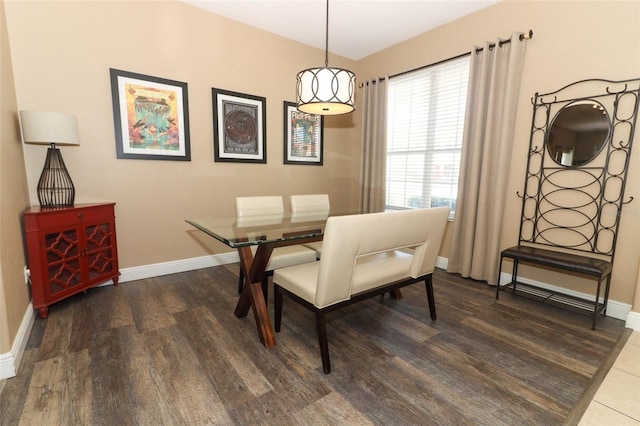 dining room with wood finished floors and baseboards