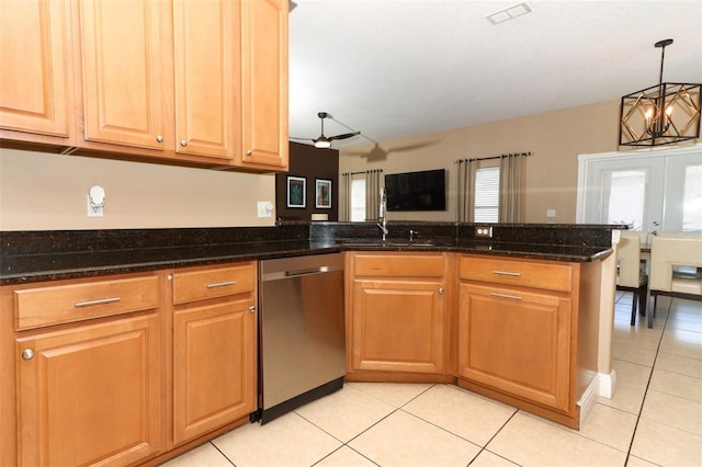 kitchen with visible vents, dishwasher, light tile patterned floors, a peninsula, and a sink