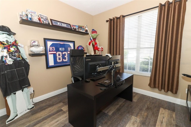 home office featuring baseboards and wood finished floors