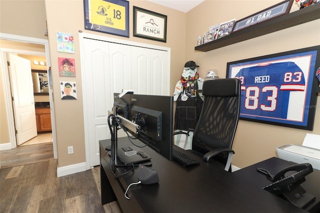 home office featuring wood finished floors and baseboards