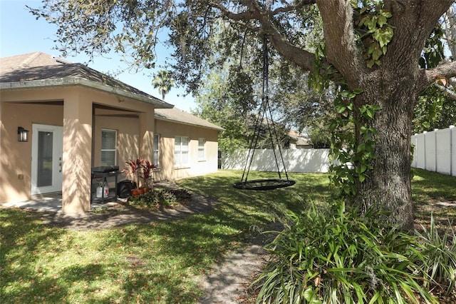 view of yard with fence