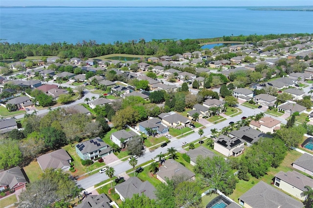 birds eye view of property featuring a residential view and a water view