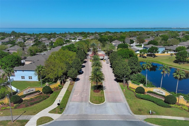 bird's eye view with a residential view and a water view