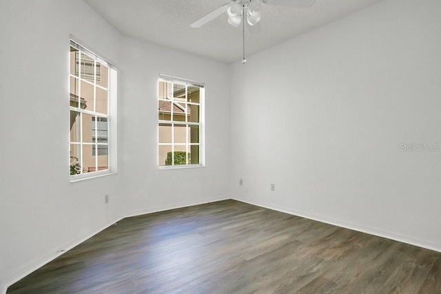 unfurnished room featuring baseboards, a textured ceiling, wood finished floors, and a ceiling fan