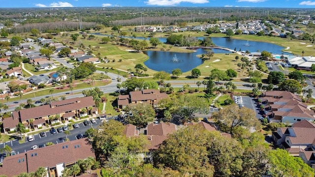 birds eye view of property featuring a residential view, a water view, and view of golf course