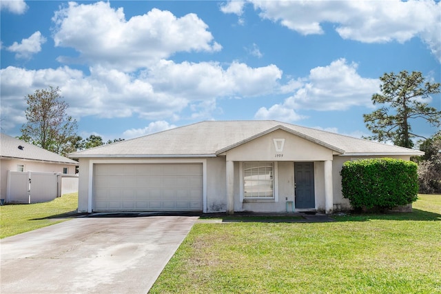 single story home with concrete driveway, a garage, a front yard, and stucco siding