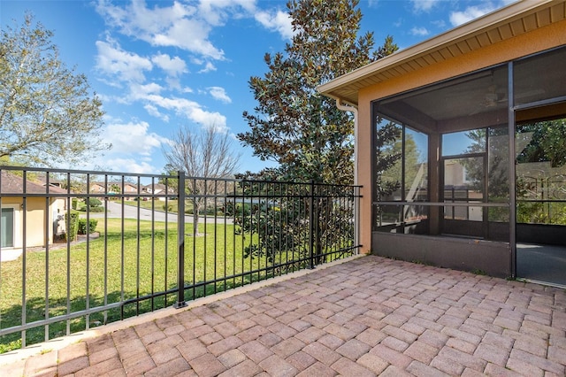 view of patio / terrace featuring a sunroom