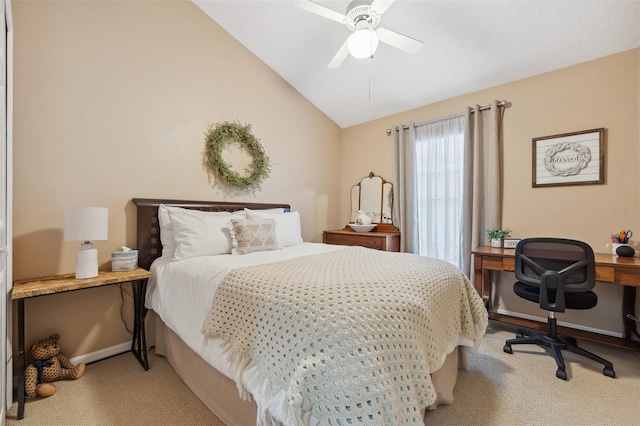 bedroom with baseboards, lofted ceiling, a ceiling fan, and carpet flooring