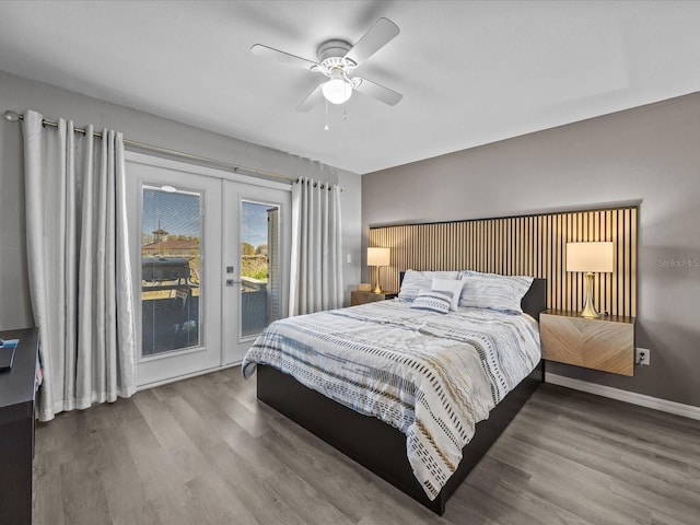 bedroom featuring access to exterior, ceiling fan, baseboards, french doors, and wood finished floors