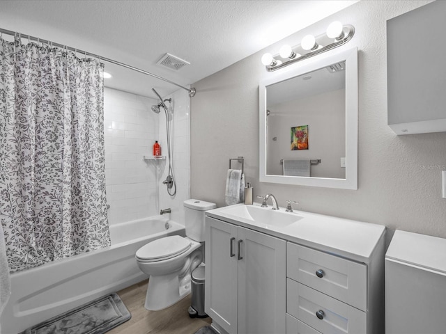 bathroom featuring wood finished floors, visible vents, a textured ceiling, toilet, and shower / tub combo with curtain