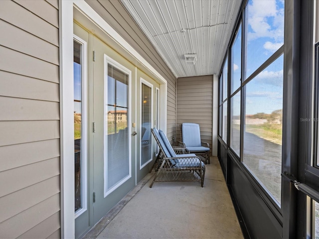 unfurnished sunroom with french doors