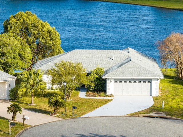 birds eye view of property with a water view