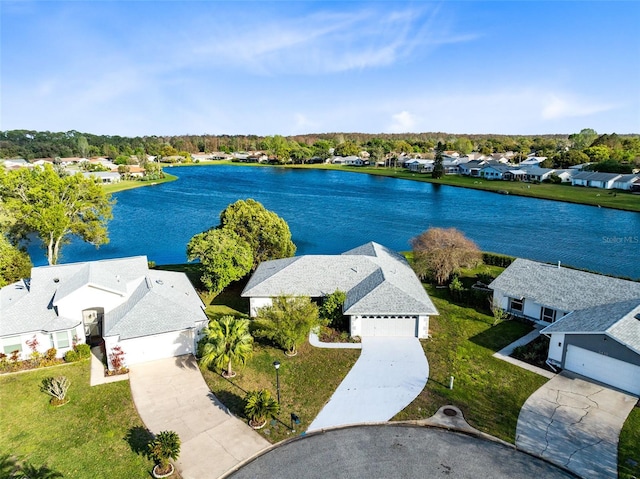 drone / aerial view with a residential view and a water view