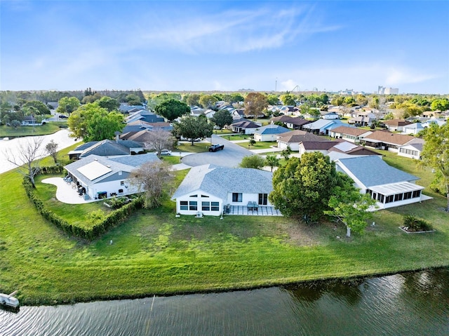 bird's eye view featuring a residential view and a water view