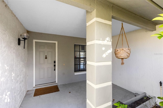 doorway to property with stucco siding