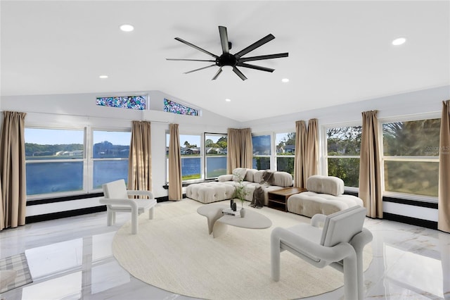 living area with recessed lighting, a water view, lofted ceiling, and a ceiling fan