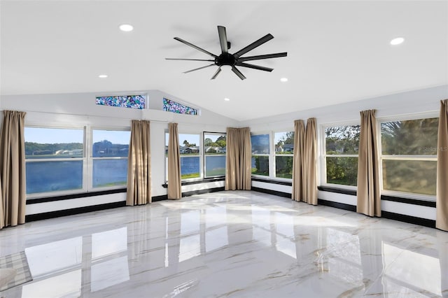 spare room featuring vaulted ceiling, recessed lighting, marble finish floor, and ceiling fan