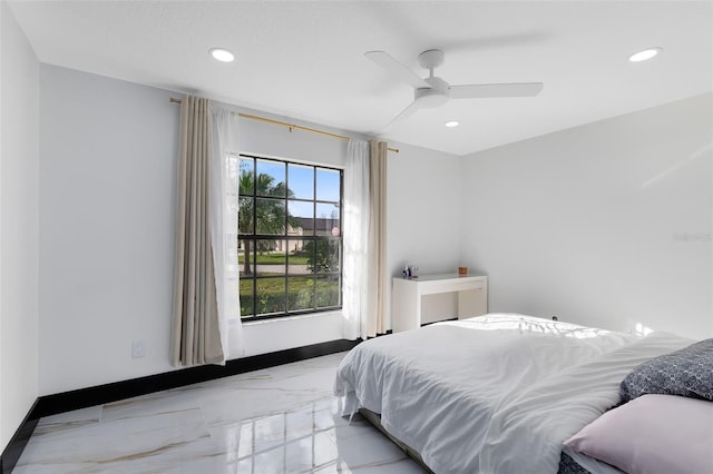 bedroom with recessed lighting, marble finish floor, and baseboards