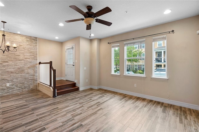 1341 Mill Stream Ln, Winter Springs, FL 32708 - unfurnished room with recessed lighting, baseboards, wood finished floors, and ceiling fan with notable chandelier