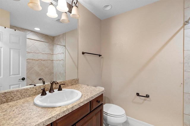 1341 Mill Stream Ln, Winter Springs, FL 32708 - bathroom featuring vanity, toilet, baseboards, and a tile shower