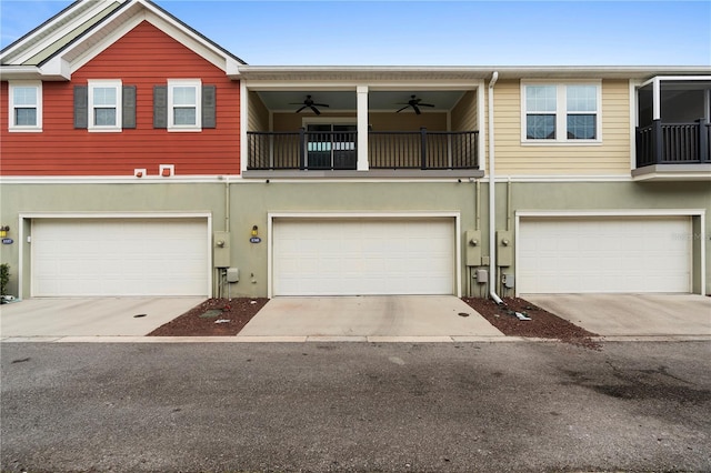 1341 Mill Stream Ln, Winter Springs, FL 32708 - townhome / multi-family property featuring stucco siding, a garage, concrete driveway, and a ceiling fan