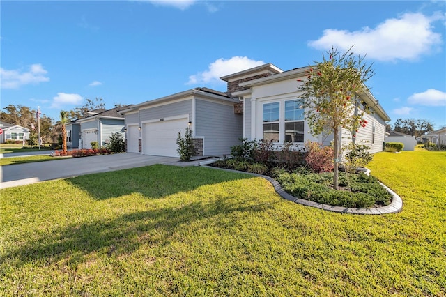 view of front of house with a front yard, a garage, and driveway