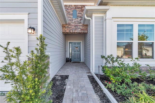 view of exterior entry with stone siding