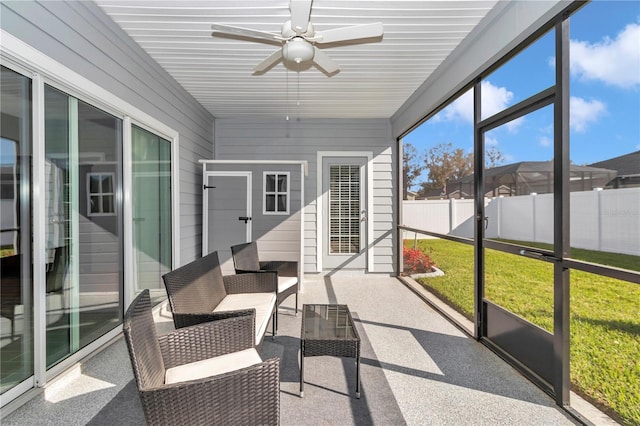 sunroom / solarium with ceiling fan