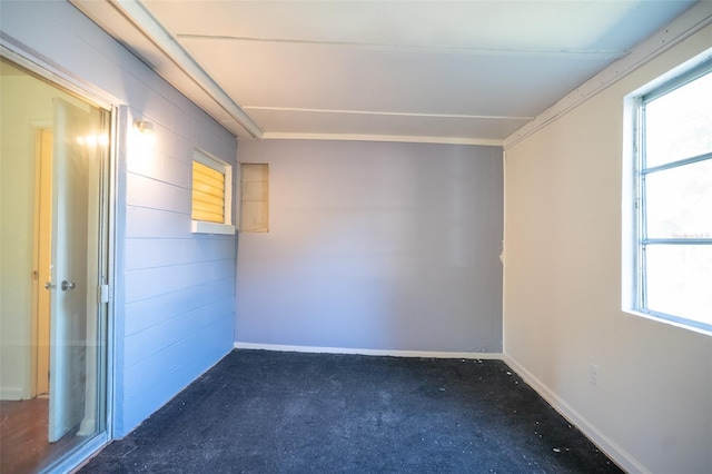 empty room featuring baseboards