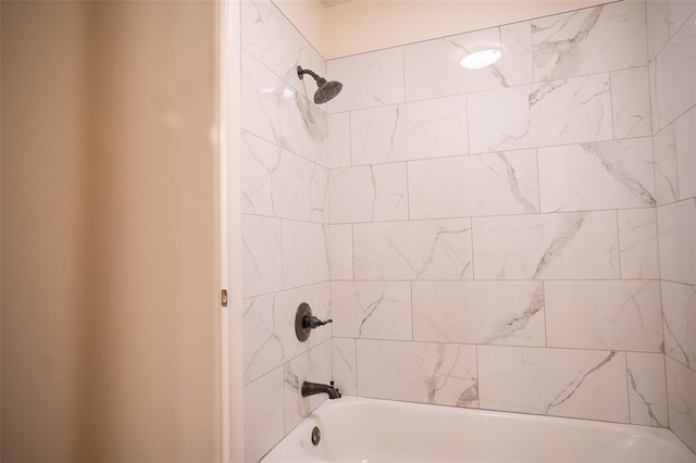 bathroom with tub / shower combination