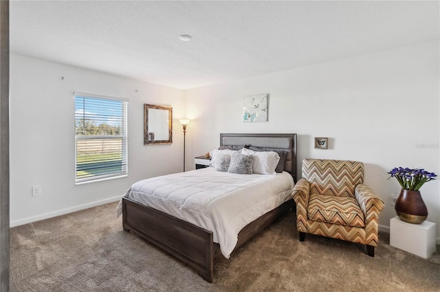 bedroom featuring baseboards and carpet floors