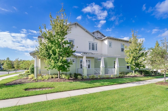 view of front of property with a front lawn and stucco siding