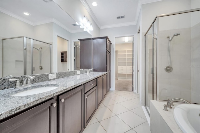 bathroom with ornamental molding, a stall shower, and a sink