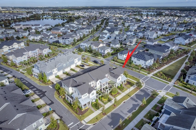 birds eye view of property featuring a residential view and a water view