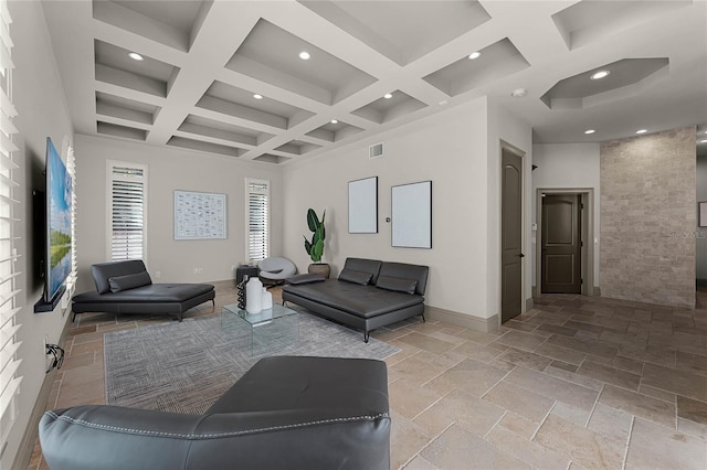 living room featuring visible vents, beamed ceiling, a towering ceiling, stone tile flooring, and coffered ceiling