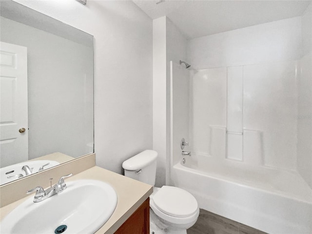 full bathroom featuring toilet, vanity, shower / bathing tub combination, and wood finished floors