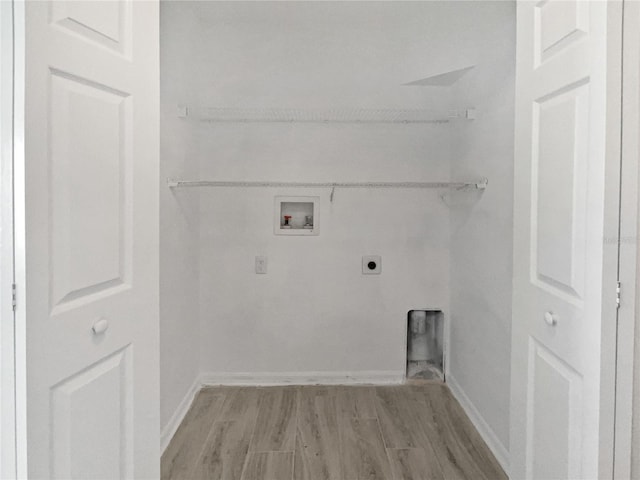 laundry room featuring baseboards, light wood-type flooring, laundry area, hookup for a washing machine, and hookup for an electric dryer