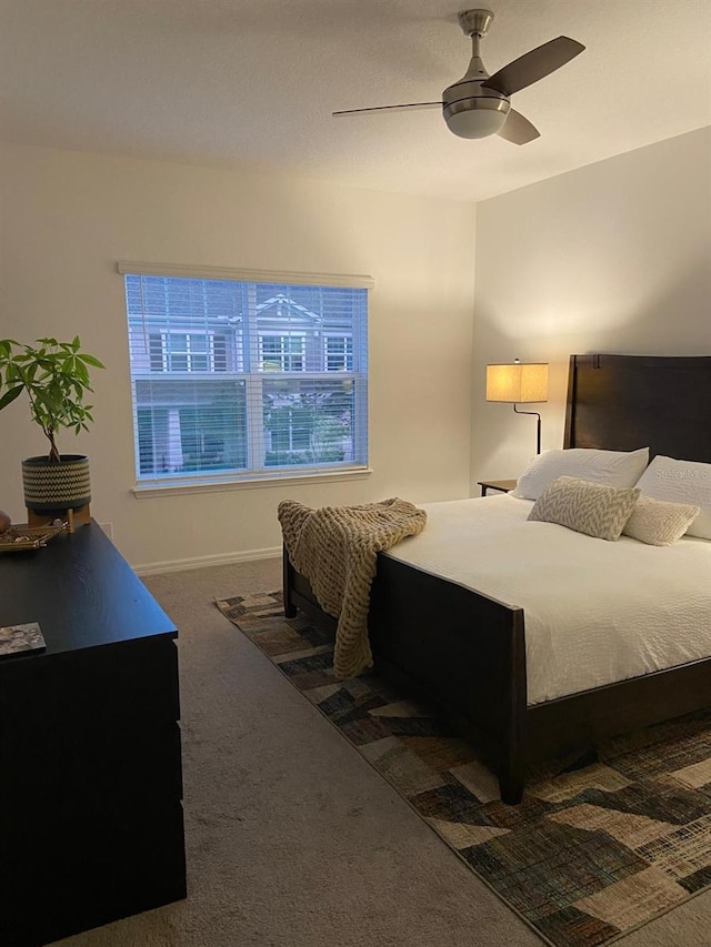 carpeted bedroom with a ceiling fan