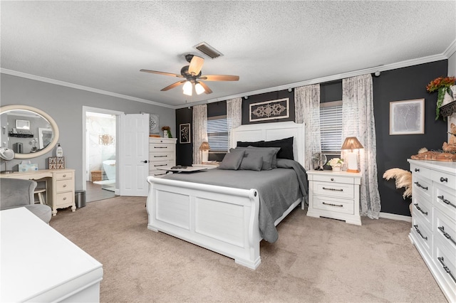 bedroom with visible vents, light colored carpet, a textured ceiling, and crown molding