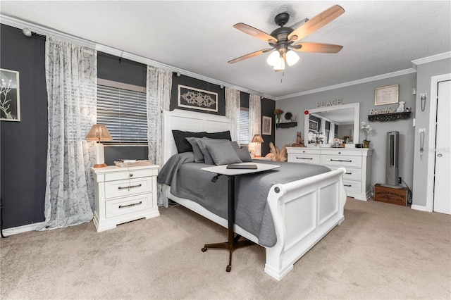 bedroom with a textured ceiling, ornamental molding, ceiling fan, and light carpet