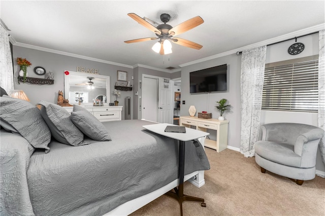 bedroom featuring baseboards, light carpet, a ceiling fan, and crown molding