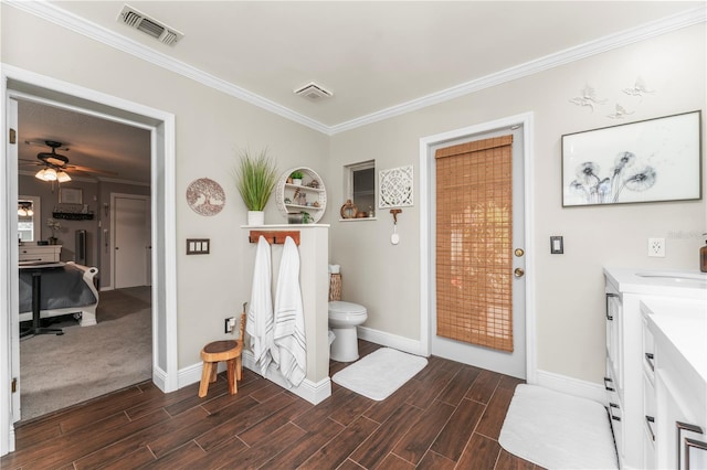 bathroom featuring visible vents, a ceiling fan, ornamental molding, and wood tiled floor