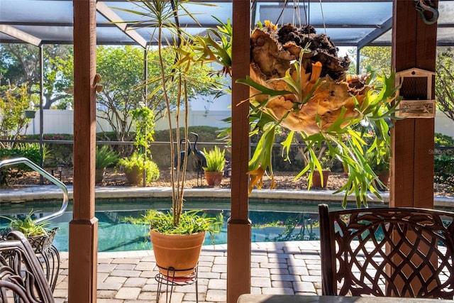 view of swimming pool featuring a fenced in pool, a lanai, and fence