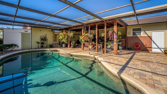 outdoor pool featuring a lanai and a patio area