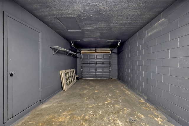 garage featuring concrete block wall