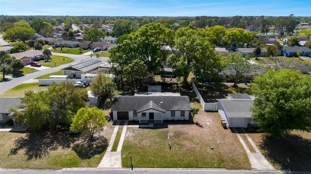 birds eye view of property with a residential view