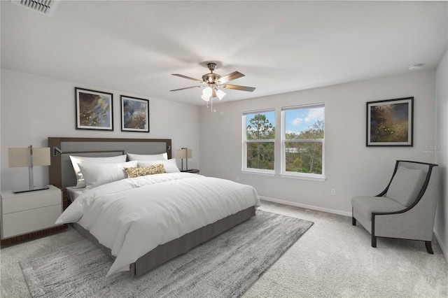 bedroom featuring carpet flooring, baseboards, visible vents, and a ceiling fan