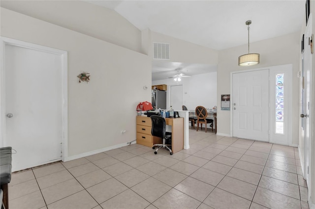 foyer entrance with visible vents, a ceiling fan, baseboards, light tile patterned floors, and lofted ceiling