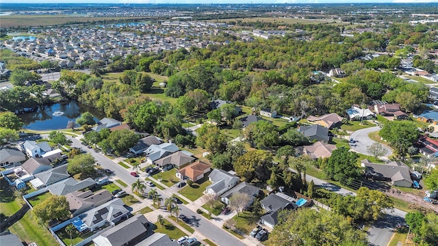 bird's eye view featuring a residential view and a water view