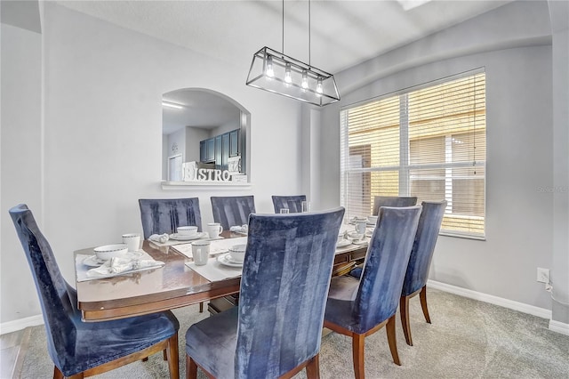 1028 Orange Cosmos Blvd, Davenport, FL 33837 - carpeted dining room with healthy amount of natural light and arched walkways